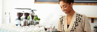 Smiling woman working in a coffee shop