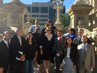 Advocates of legislation to grant undocumented persons driver’s licenses gather on the steps of the State Capitol Tuesday, September 20, 2016