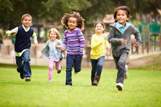 Happy children running in a park