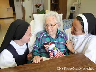 Nuns and an elderly woman in the hospital