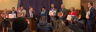 Attendees of a press conference at the Michigan Capitol with a bipartisan group of State Senators who support Raise the Age legislation
