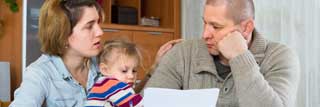 Concerned about their finances, a young couple try to reassure one another