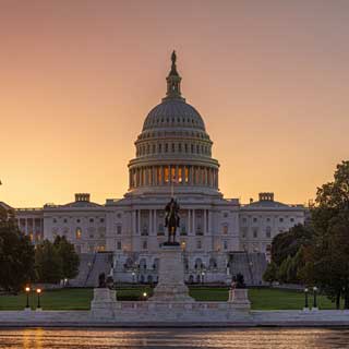 The sun setting on the U.S. Capital Building
