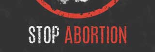 A worn illustration of a white hand inside a red circle with the words Stop Abortion underneath.