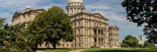 The Michigan State Capitol building on a sunny day.