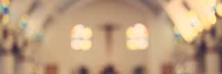 The interior of a Catholic church, blurred for artistic effect.