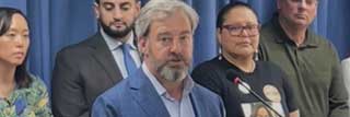 Tom Hickson, vice president for public policy and advocacy for MCC, speaks at a press conference announcing the driver’s license legislation. Bill sponsors pictured behind him include Sen. Stephanie Chang (left) and Rep. Abraham Aiyash (second from left).