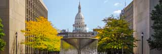 The Michigan State Capitol Building as seen from the Capital Complex pathway.