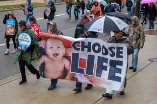 Participants in the Michigan March for Life holding a Choose Life banner