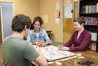 Case managers representing The Ark interact with a client. The Ark is an outreach program offered by Catholic Charities for the Diocese of Kalamazoo (CCDOK) for homeless or runaway youth. Credit: CCDOK