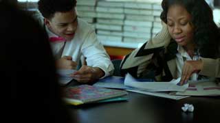 Two Christo Rey students study together