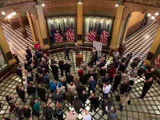 Michigan nonpublic school educators attending a Public Policy Day event in the Michigan State Capitol Building rotunda