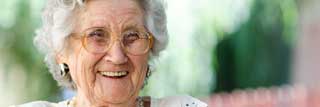 An elderly woman smiling