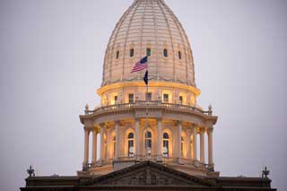 The dome of the Michigan State Capital building seen from the outside at dusk