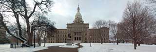 The outside of the Michigan State Capital building on a snowy winter day