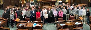 The Lansing Catholic Cougars football team being celebrated this week at the state Capitol for their 2021 state championship in an event hosted by State Rep. Sarah Anthony (D-Lansing) and attended by state lawmakers from the Capitol region.
