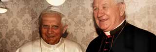 Pope Benedict XVI appears alongside former Cardinal Adam Joseph Maida, who was Archbishop of Detroit and chair of the MCC Board of Directors from 1990 to 2009.