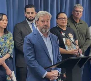 Tom Hickson, vice president for public policy and advocacy for MCC, speaks at a press conference announcing the driver’s license legislation. Bill sponsors pictured behind him include Sen. Stephanie Chang (left) and Rep. Abraham Aiyash (second from left).