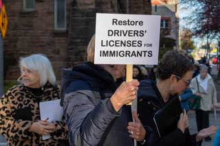 Grassroots activists with the Catholic-affiliated group Strangers No Longer visit the state Capitol in support of legislation to allow undocumented immigrants to access driver’s licenses or identification cards in Michigan.