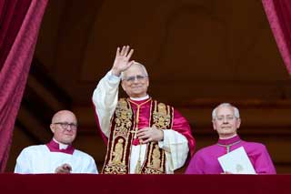 Pope Leo XIV waving to the people gathered in St Peter's Square.