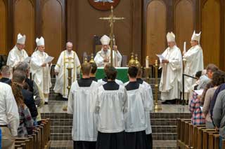 The bishops, wearing their miters, from left to right: Bishop Jeffrey Walsh of Gaylord, Bishop Edward Lohse of Kalamazoo, Bishop Earl Boyea of Lansing, Auxiliary Bishop Robert Fisher of Detroit, and Bishop David Walkowiak of Grand Rapids.