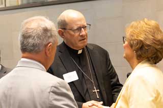 Bishop David Walkowiak of the Diocese of Grand Rapids, with Paul Stankewitz (left), policy advocate for MCC, and Rep. Nancy DeBoer (R-Holland).